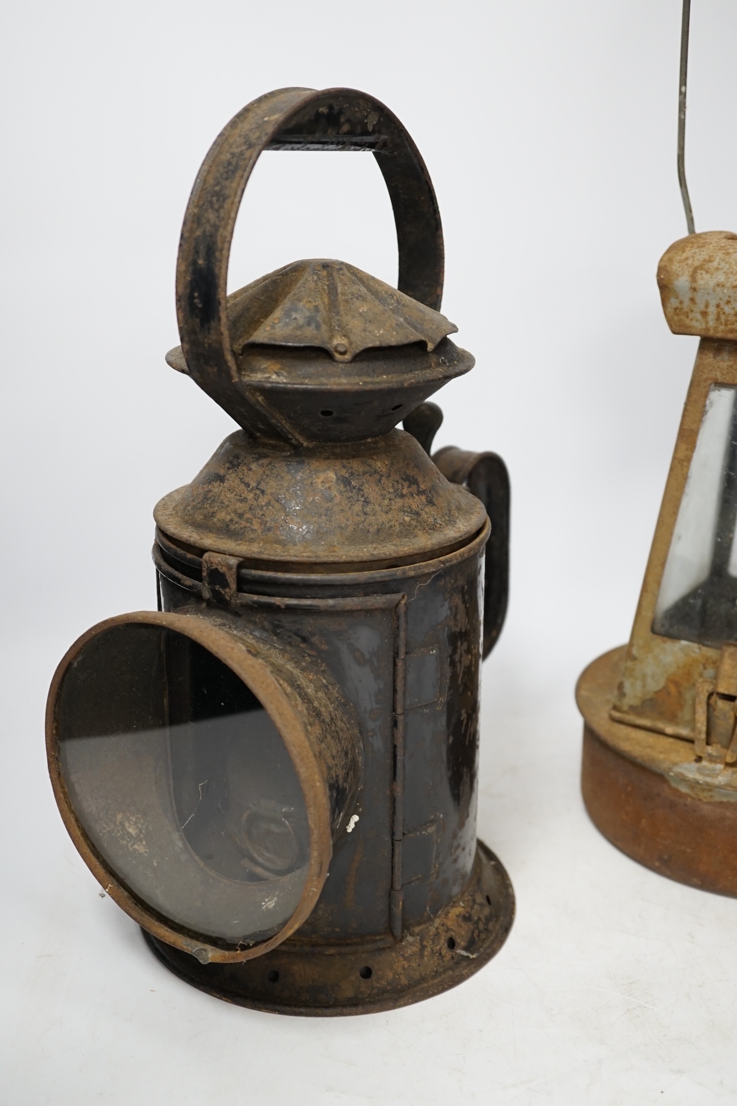 Two late 19th / early 20th century Sherwoods railway lamps, largest 34cm high. Condition - fair, rust and wear to both